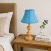 Handcrafted wooden table lamp with blue fabric shade