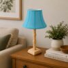 Handcrafted wooden table lamp with blue fabric shade
