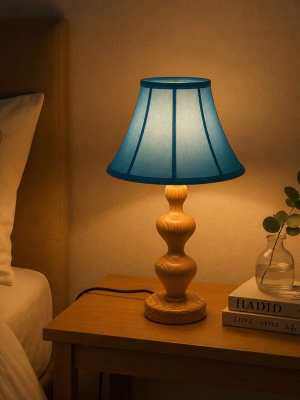 Modern wooden bedside lamp with sculptural base