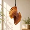 Sculptural wooden pendant light handcrafted from pine wood